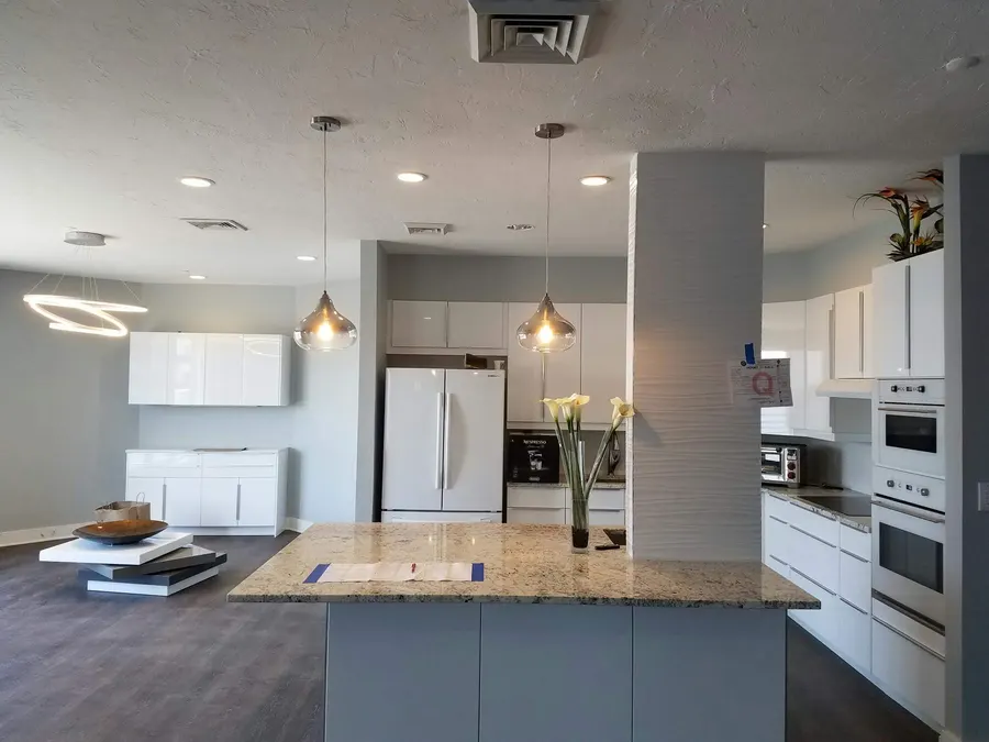 Open kitchen with island and white cabinets