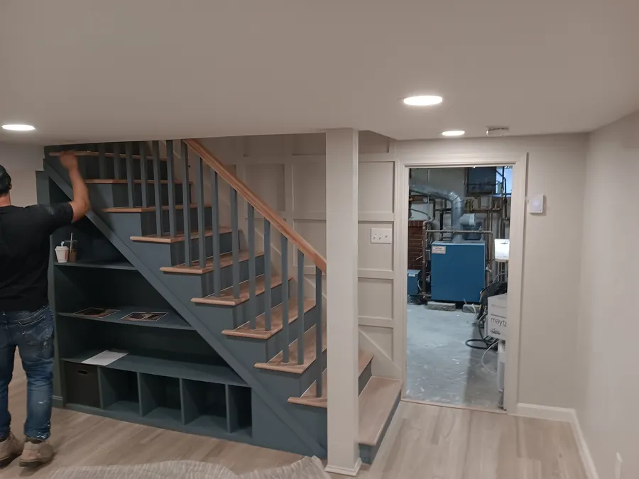 Basement staircase with built-in storage